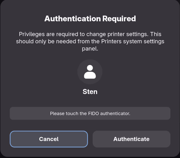 GNOME polkit dialog showing “Please touch the FIDO authenticator.”